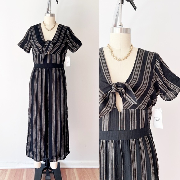 Sadie & Sage Black and Cream Jumpsuit with Peekaboo Detail and Front Tie Striped - Picture 1 of 7